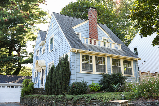 suburban-house-symbolizing-mortgage-housing-crisis-rising-prices-inflation-housing