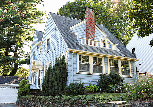 suburban-house-symbolizing-mortgage-housing-crisis-rising-prices-inflation-housing